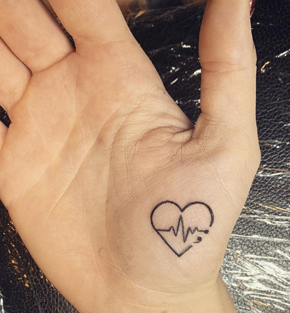 small heartbeat tattoo with name