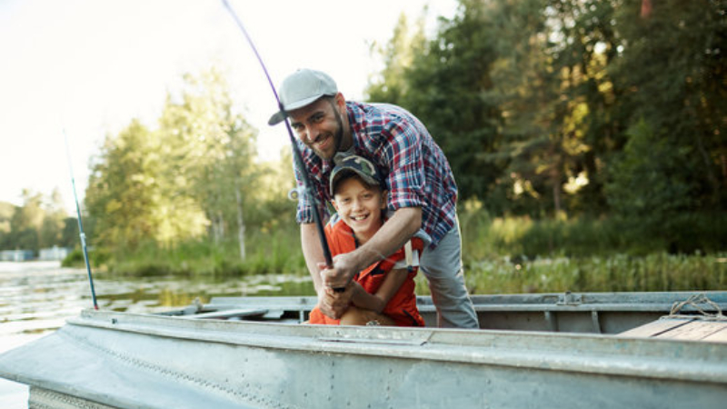 ai prompt father and son boating on lake