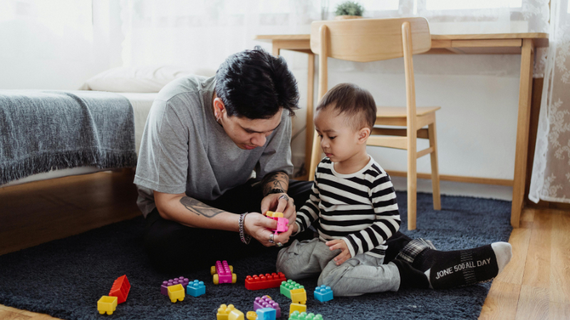 ai prompt father and son building with lego