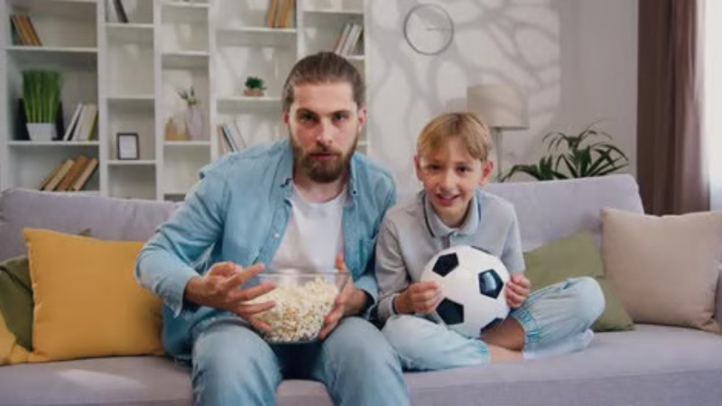 ai prompt father and son watching game