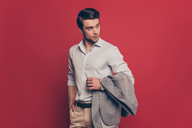 hands holding clothing or jacket