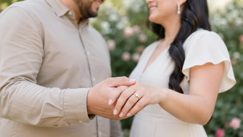 close view of couple's hands and engagement ring