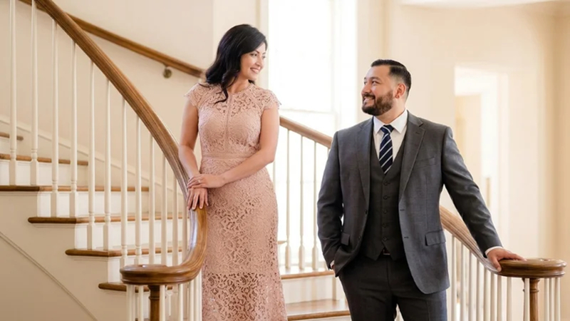 couple posing naturally on different staircase steps