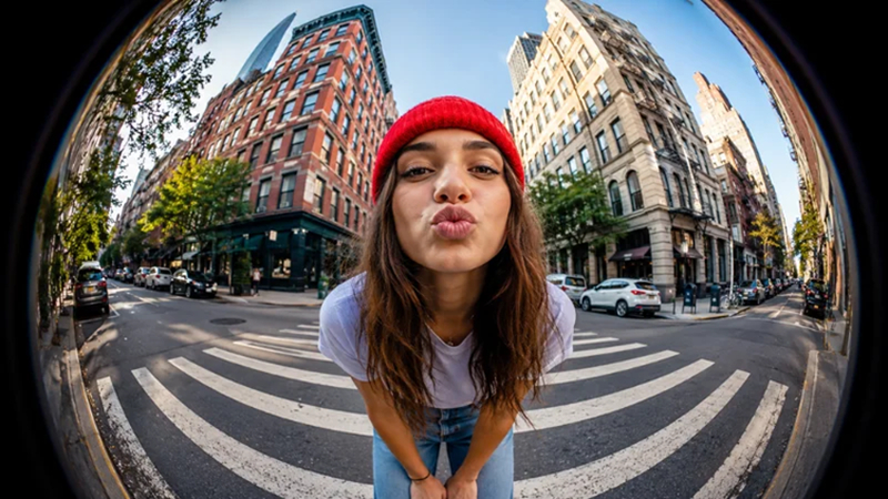 girl centered within curved cityscape