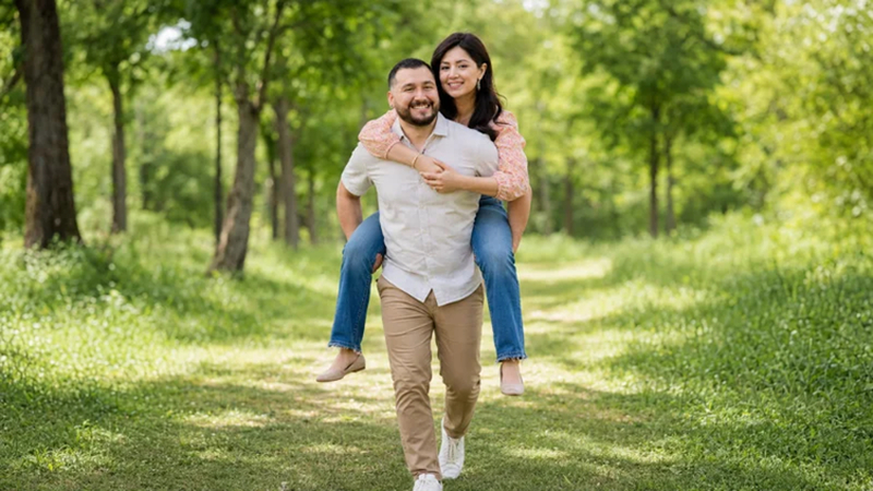 smiling couple enjoying a playful piggyback ride