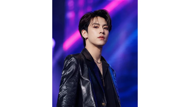 k-pop inspired musician under colorful stage lights