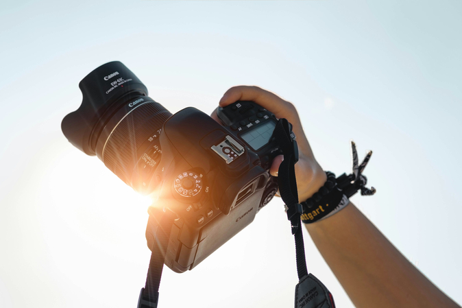 a boy holding his camera
