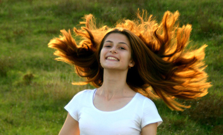 A girl Tossing her hairs