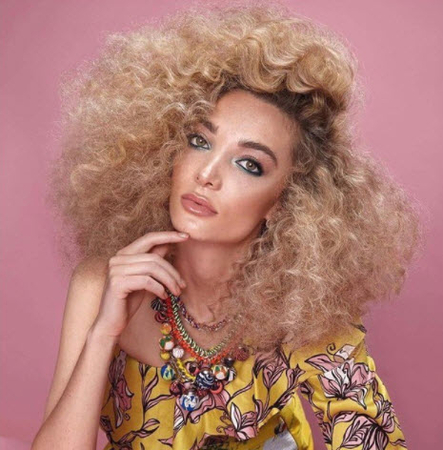 a girl with multi textured perm