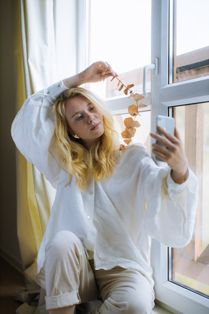a girl with side profile with cheek on hand