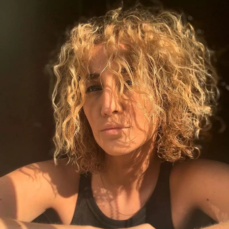 a girl with spiral perm