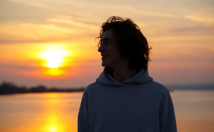 a photo is capture of boy with sunlight