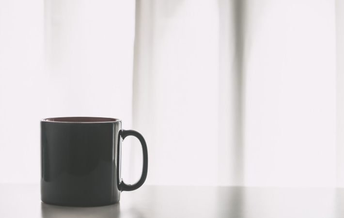 a photo of mug on white table