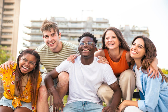 A Multicultural Group of Friends Laughing Outdoors