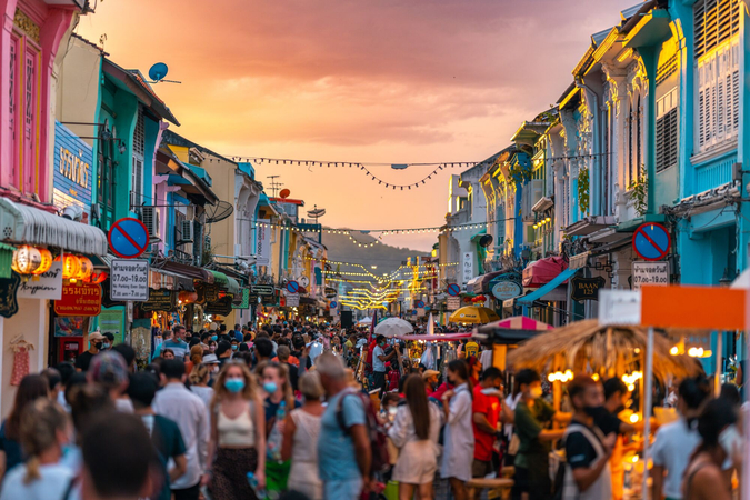 Travelers Exploring a Colorful Local Market