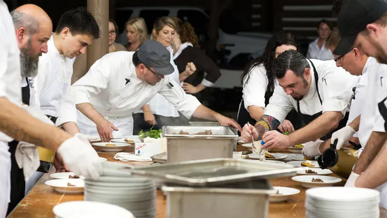 Chefs Collaborating in a Kitchen
