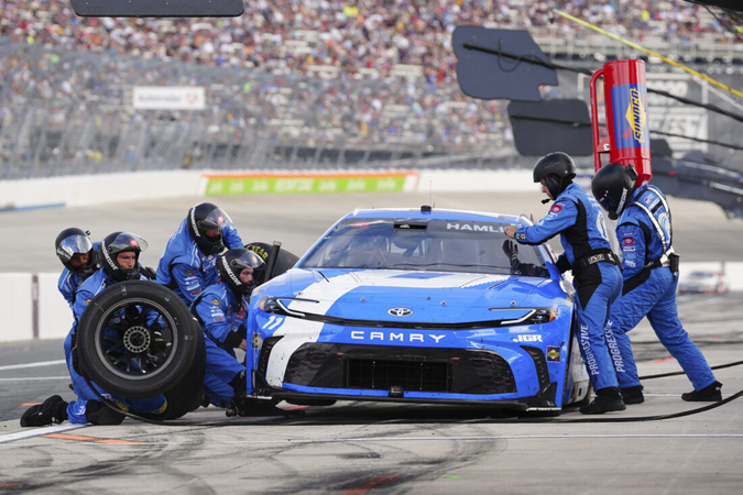 On Sunday, July 20, 2025, during a NASCAR Cup Series auto race at Dover Motor Speedway, Denny Hamlin pulls in for a pit stop in Dover, Delaware.