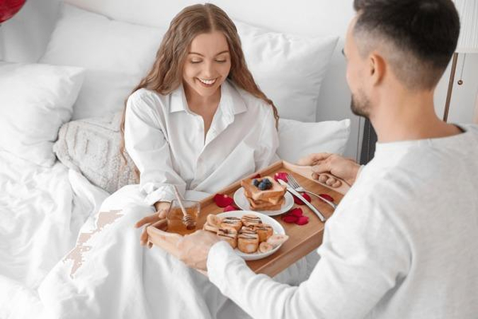children serving dad breakfast in bed