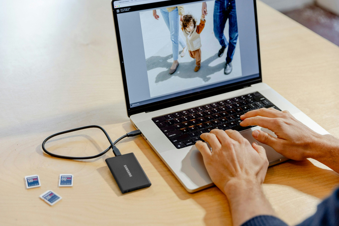 man edit the pictures for his clients