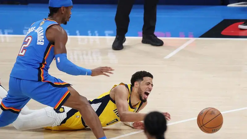 Haliburton screaming in pain after falling to the ground with an injury during Game 7