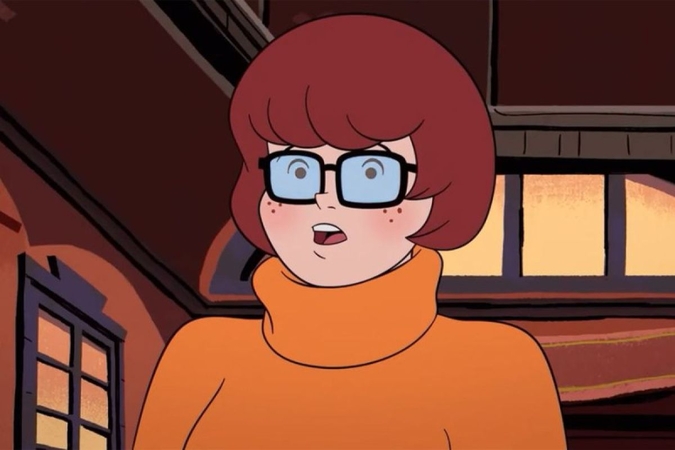 girl-in-orange-sweater-with-glasses-and-short-bob-haircut