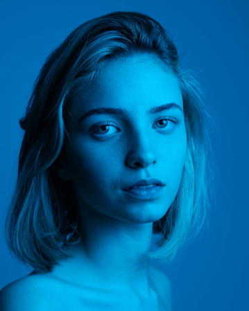 clean headshot portrait on a blue and white background