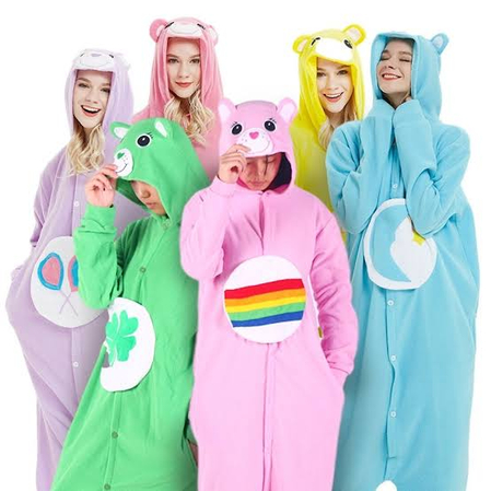 Four people wearing fluffy colorful Care Bears onesies with tummy symbols