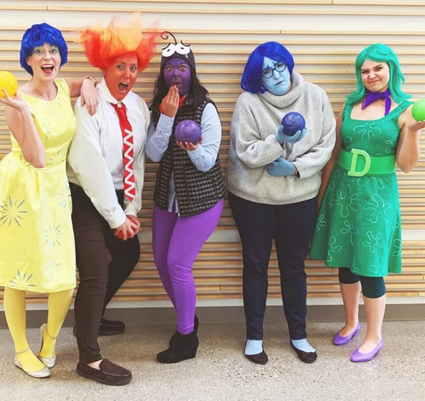 Four friends dressed in vibrant colored outfits representing Inside Out emotions