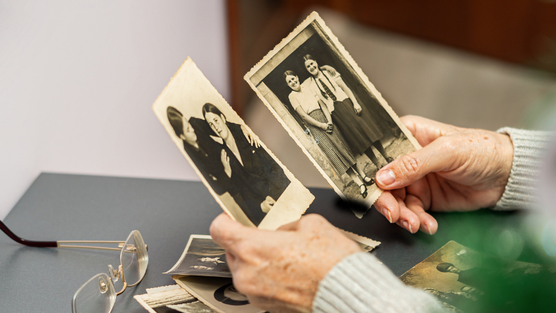 old faded and scratched vintage photo with visible damage