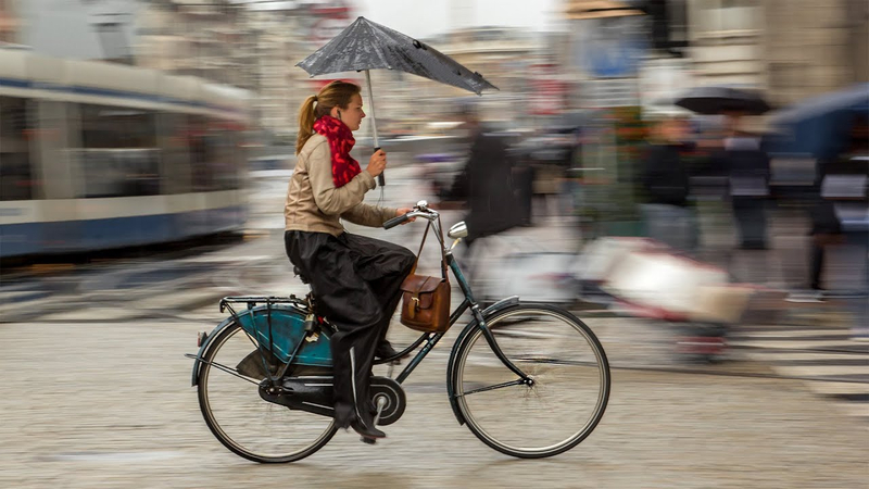 panning shot of a girl riding a bicycle